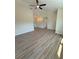 Open living space features high ceilings, fan, and flows into other rooms, creating a seamless design at 8413 Monarch Dr, Port Richey, FL 34668