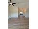 Inviting living room featuring luxury vinyl plank flooring and recessed lighting, leading to a dining area at 8413 Monarch Dr, Port Richey, FL 34668
