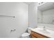 Clean bathroom featuring a vanity with a framed mirror and a toilet at 8461 Apple Orchard Rd, Spring Hill, FL 34608