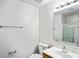 Clean bathroom featuring a vanity with a framed mirror and a shower with glass doors at 8461 Apple Orchard Rd, Spring Hill, FL 34608