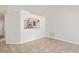 Bright living room with tile flooring, an open layout, and a view into the kitchen at 8461 Apple Orchard Rd, Spring Hill, FL 34608