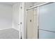 Shower featuring white tile walls and a sliding glass door at 8461 Apple Orchard Rd, Spring Hill, FL 34608