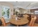 Cozy dining area blending seamlessly into the living room, enhancing the home's open feel at 8514 Ashbury Dr, Hudson, FL 34667