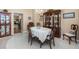 Charming dining room with traditional furnishings and a view into another room at 8514 Ashbury Dr, Hudson, FL 34667