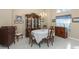 Elegant dining room with classic furniture, a chandelier, and ample natural light at 8514 Ashbury Dr, Hudson, FL 34667