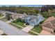 Charming single-story home with brick driveway, manicured lawn, and mature trees in a quiet neighborhood at 8514 Ashbury Dr, Hudson, FL 34667