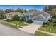 Lovely home with a spacious driveway, lush lawn, and beautiful landscaping, providing a welcoming entrance at 8514 Ashbury Dr, Hudson, FL 34667