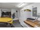 Organized two car garage with a refrigerator, ample storage, and work bench at 8514 Ashbury Dr, Hudson, FL 34667