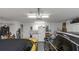 Well-organized two car garage with storage, utility sink, and access to the backyard at 8514 Ashbury Dr, Hudson, FL 34667