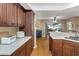 Updated kitchen featuring stone countertops, wood cabinets, and stainless steel appliances at 8514 Ashbury Dr, Hudson, FL 34667