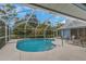 Sparkling pool with screened enclosure and ample deck space for lounging and entertainment at 8514 Ashbury Dr, Hudson, FL 34667