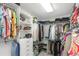 Spacious walk-in closet with built-in shelving and ample storage for clothes and accessories at 8514 Ashbury Dr, Hudson, FL 34667