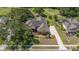 Aerial view of a well-manicured home that backs onto a lush green golf course at 888 Royal Birkdale Dr, Tarpon Springs, FL 34688