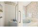 Bathroom featuring a tiled shower and soaking tub with a custom stained glass window at 888 Royal Birkdale Dr, Tarpon Springs, FL 34688