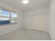 Neutral bedroom featuring carpet and a built in closet at 888 Royal Birkdale Dr, Tarpon Springs, FL 34688