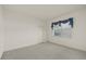 Simple bedroom featuring neutral carpets and a window at 888 Royal Birkdale Dr, Tarpon Springs, FL 34688