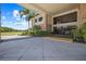 Impressive building exterior with lush landscaping and palm trees, creating a welcoming atmosphere under a sunny sky at 888 Royal Birkdale Dr, Tarpon Springs, FL 34688