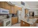 Kitchen featuring a center island, modern appliances, and generous counter space at 888 Royal Birkdale Dr, Tarpon Springs, FL 34688