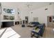 Spacious living room with fireplace, large windows, and comfortable seating at 888 Royal Birkdale Dr, Tarpon Springs, FL 34688