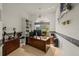 Inviting office space featuring a large wooden desk, built-in shelving, and decorative fish wall decor at 888 Royal Birkdale Dr, Tarpon Springs, FL 34688