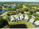Gorgeous aerial view of homes with pools near golf course and lakes in a lush, green community at 9010 Penelope Dr, Weeki Wachee, FL 34613
