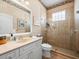 Bathroom features a large shower, sink, and toilet at 9010 Penelope Dr, Weeki Wachee, FL 34613