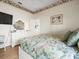 Well lit bedroom with dresser, bed and floral comforter at 9010 Penelope Dr, Weeki Wachee, FL 34613