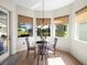 Breakfast nook featuring a glass table with views of the outdoor scenery at 9010 Penelope Dr, Weeki Wachee, FL 34613