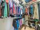 Walk-in closet with clothing racks and shelves for storage at 9010 Penelope Dr, Weeki Wachee, FL 34613