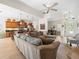 Open living space with modern furniture, flowing into a dining area and well-equipped kitchen at 9010 Penelope Dr, Weeki Wachee, FL 34613