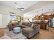 Open living space featuring a modern kitchen, a large sectional couch, and a ceiling fan at 9010 Penelope Dr, Weeki Wachee, FL 34613