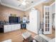 Home office with custom built-ins, a ceiling fan, and a window for natural light at 9010 Penelope Dr, Weeki Wachee, FL 34613