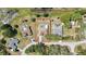 A direct aerial shot showing property lines highlighting the pool and surrounding homes at 9088 Gallup Cir, Spring Hill, FL 34608