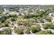 Aerial shot of a home and pool area, highlighting the surrounding green space and neighborhood at 9088 Gallup Cir, Spring Hill, FL 34608