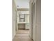 Well-lit bathroom features a long vanity, a mirror, and storage space at 9088 Gallup Cir, Spring Hill, FL 34608