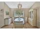 Inviting dining area with hardwood floors, natural lighting, and ample space for hosting Gathering and friends at 9088 Gallup Cir, Spring Hill, FL 34608