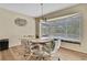 Charming dining area with a bay window providing natural light and views of the backyard pool at 9088 Gallup Cir, Spring Hill, FL 34608
