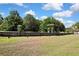 A serene dock, surrounded by lush trees, provides access to tranquil waters for boating and recreation at 9088 Gallup Cir, Spring Hill, FL 34608