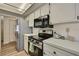 Functional kitchen equipped with stainless steel appliances including a refrigerator, oven, and overhead microwave at 9088 Gallup Cir, Spring Hill, FL 34608