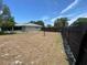Large fenced backyard offering privacy and space for outdoor activities at 9186 Patio Ct, Spring Hill, FL 34608
