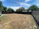 Extensive, fenced backyard offers a blank canvas for landscaping and outdoor living, ideal for relaxation and recreation at 9186 Patio Ct, Spring Hill, FL 34608