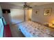 Bedroom with natural light, ceiling fan, tile flooring, and a closet at 9186 Patio Ct, Spring Hill, FL 34608