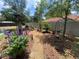 Charming garden path with stone pavers, lush plantings, and decorative accents creating a peaceful retreat at 9186 Patio Ct, Spring Hill, FL 34608