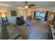 Cozy living room with comfortable seating, soft carpet and natural lighting at 9186 Patio Ct, Spring Hill, FL 34608
