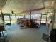 Relaxing screened-in porch featuring an above-ground pool and lounge seating area at 9186 Patio Ct, Spring Hill, FL 34608