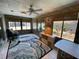 Cozy sun room featuring tile flooring, natural lighting and view of the backyard at 9186 Patio Ct, Spring Hill, FL 34608
