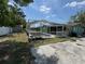Exterior view of enclosed pool and cement deck at 9285 Carthage Rd, Spring Hill, FL 34608