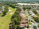 Scenic aerial view of homes bordering a lush golf course, showcasing community and beautiful green landscape at 9355 French Quarters Cir, Weeki Wachee, FL 34613
