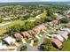 Overhead shot of homes along a golf course, showcasing community and proximity to green spaces at 9355 French Quarters Cir, Weeki Wachee, FL 34613