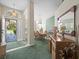Open dining area with bright windows and a view of the front yard, complemented by a stylish light fixture at 9355 French Quarters Cir, Weeki Wachee, FL 34613